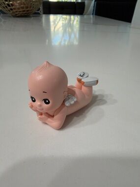 Smoko Kewpie laying down Angel Figure